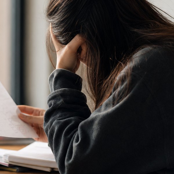 Student reviewing test answers thoughtfully — detail